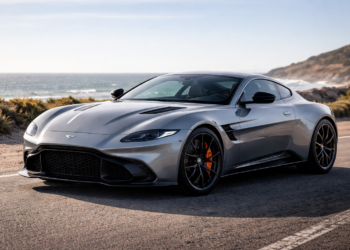 Sleek gray sports car by coastline