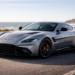Sleek gray sports car by coastline