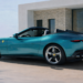 2027 Ferrari Amalfi Spider luxury convertible rear three quarter view parked beside coastal villa overlooking the ocean