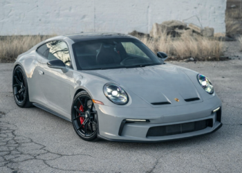 Porsche 911 GT3 in gray parked on urban pavement with black wheels and red brake calipers
