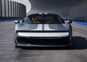 Front view of a silver Ferrari 849 Testarossa on a futuristic test track with dual white racing stripes