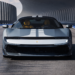 Front view of a silver Ferrari 849 Testarossa on a futuristic test track with dual white racing stripes