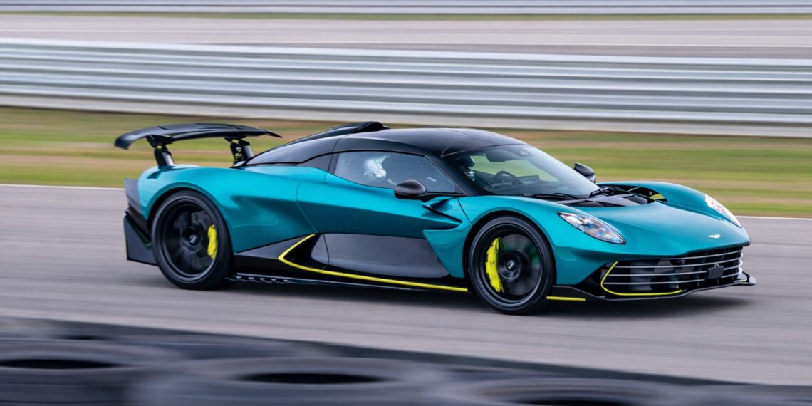 Aston Martin Valhalla hybrid supercar driving at high speed on racetrack