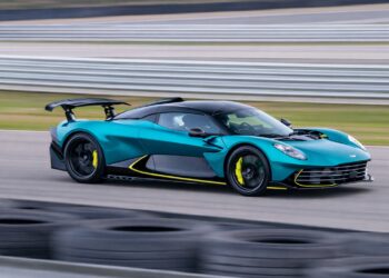 Aston Martin Valhalla hybrid supercar driving at high speed on racetrack