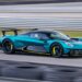 Aston Martin Valhalla hybrid supercar driving at high speed on racetrack