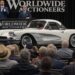Classic white Chevrolet Corvette being auctioned on stage in front of a live audience at a luxury collector car auction