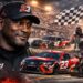 Michael Jordan with 23XI Racing NASCAR team featured image showing stock cars, pit crew action, and race-day atmosphere