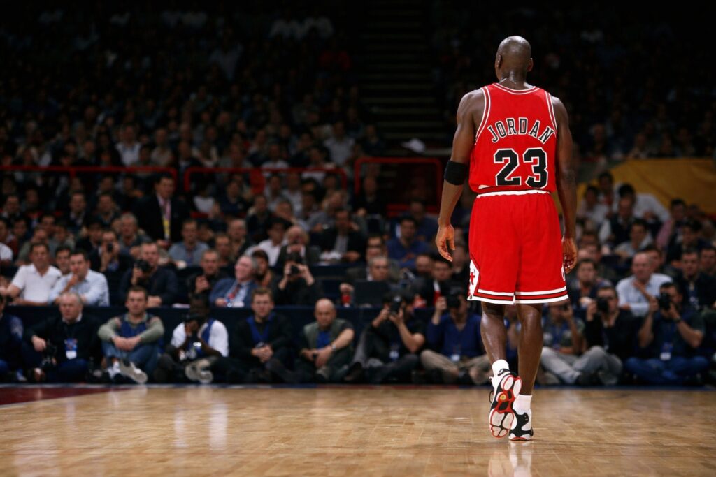 Michael Jordan number 23 Chicago Bulls walking on basketball court during game
