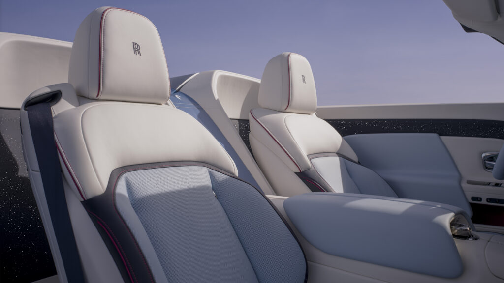 Rolls-Royce white leather seats with red accents in ultra luxury convertible interior