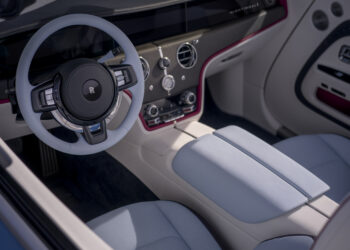 Rolls-Royce luxury interior with white leather seats, red accents, and premium dashboard design