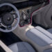 Rolls-Royce luxury interior with white leather seats, red accents, and premium dashboard design