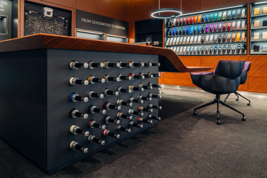 Rolls-Royce Private Office showcasing bespoke customization studio with paint samples and luxury materials