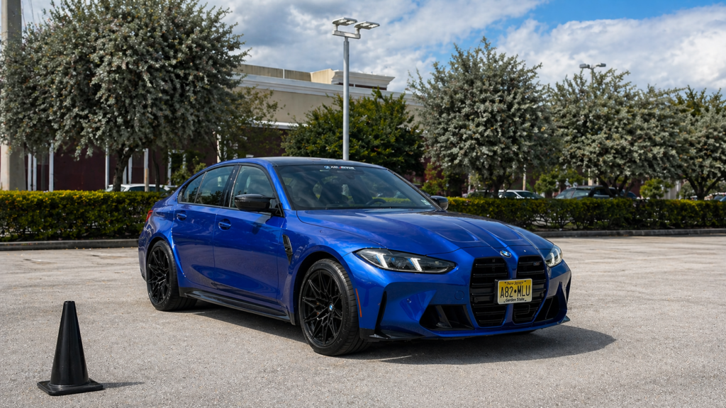 Blue BMW M3 Competition front three quarter view in Miami