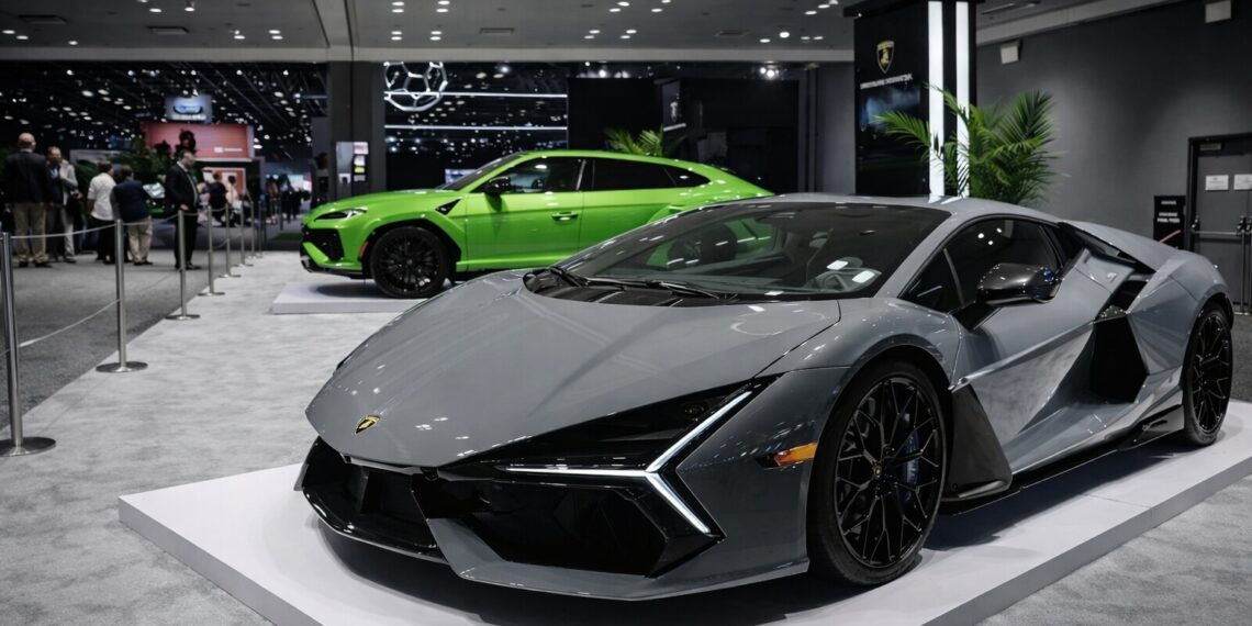 Gray Lamborghini Temerario displayed in front of a green Lamborghini Urus at the 2026 New York Auto Show