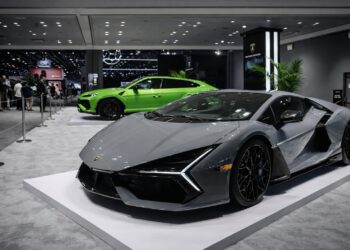 Gray Lamborghini Temerario displayed in front of a green Lamborghini Urus at the 2026 New York Auto Show