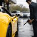 Premium fuel for exotic cars being used to refuel a luxury supercar at a high-end gas station