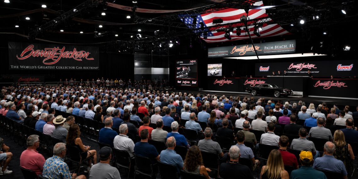 Crowd gathered inside Barrett-Jackson Palm Beach collector car auction arena during live vehicle bidding