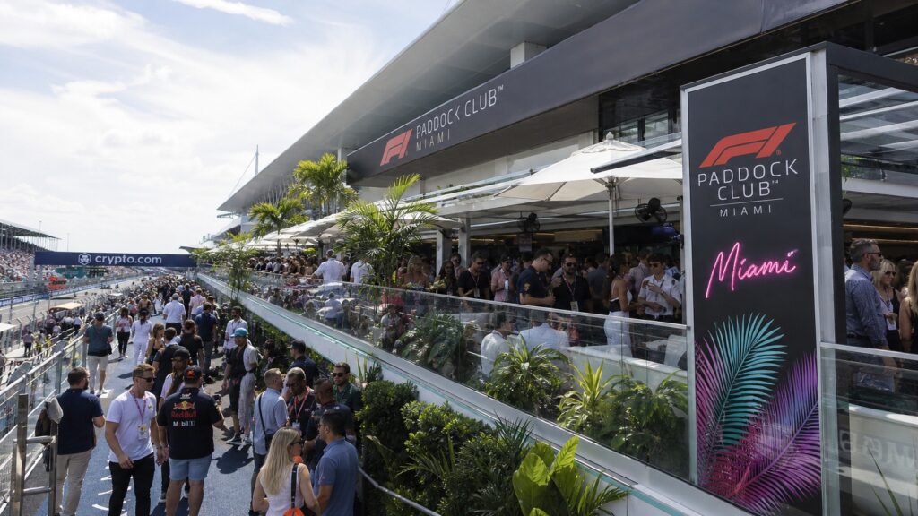 F1 Miami Paddock Club crowd overlooking pit lane with luxury hospitality suites
