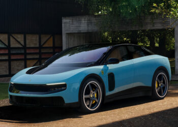 Ferrari Luce EV in blue exterior paint shown from a front three quarter angle outside a modern luxury residence