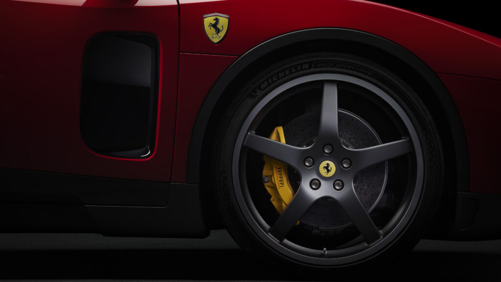 Ferrari Luce EV wheel design featuring carbon ceramic brakes, aerodynamic side intake, and Ferrari shield badge