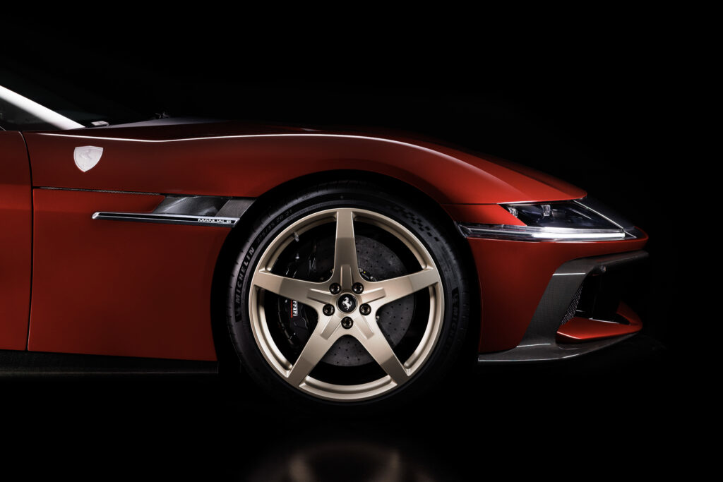 2026 Ferrari lineup: red Ferrari 12Cilindri Manuale showing its front wheel, carbon-fiber trim and Manuale fender badge