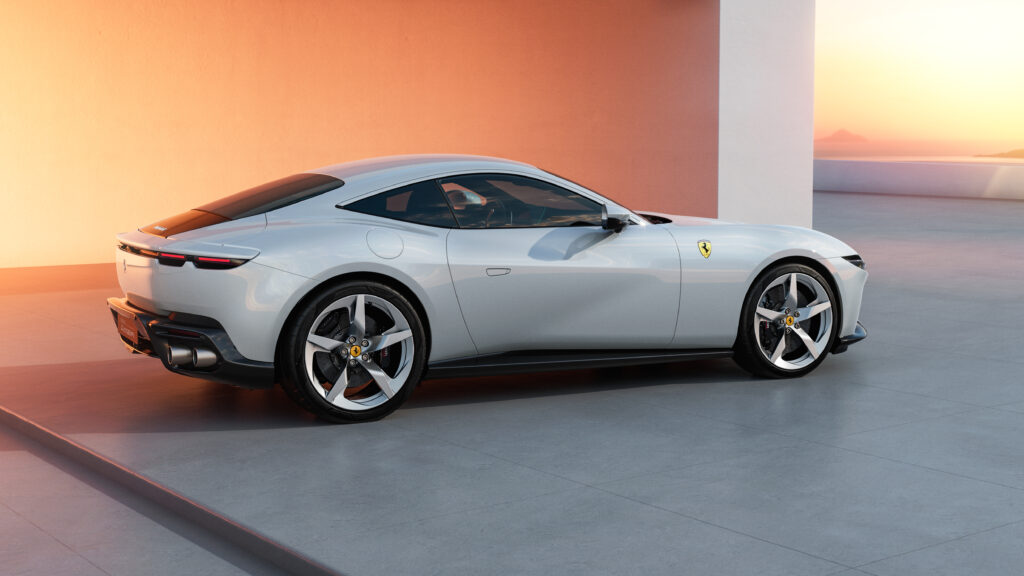 White Ferrari Amalfi shown from the rear three-quarter angle with exhaust tips