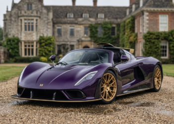 Hennessey Venom F5-M in exposed purple carbon fiber with gold accents, front three-quarter view