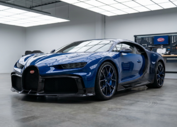 Blue and carbon fiber Bugatti Chiron parked in a private service atelier, illustrating first-year Bugatti Chiron ownership and maintenance costs