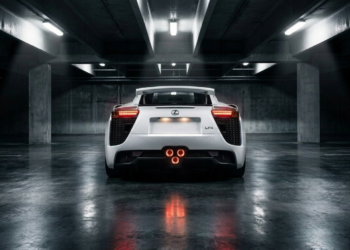 Lexus LFA rear view at night showing the triple center-exit exhaust and rear wing