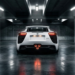 Lexus LFA rear view at night showing the triple center-exit exhaust and rear wing