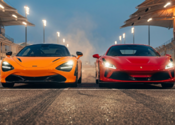 McLaren W1 and Ferrari F80 hypercars nose to nose on a racetrack at dusk