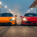 McLaren W1 and Ferrari F80 hypercars nose to nose on a racetrack at dusk