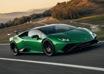 Green V12 hybrid supercar cornering at speed showcasing 48V active anti-roll technology