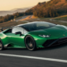 Green V12 hybrid supercar cornering at speed showcasing 48V active anti-roll technology