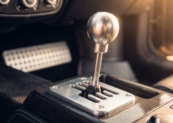 Polished aluminium gated manual shifter in an exposed metal gate on a carbon fibre tunnel, illustrating the Hennessey Blackbird gearbox layout