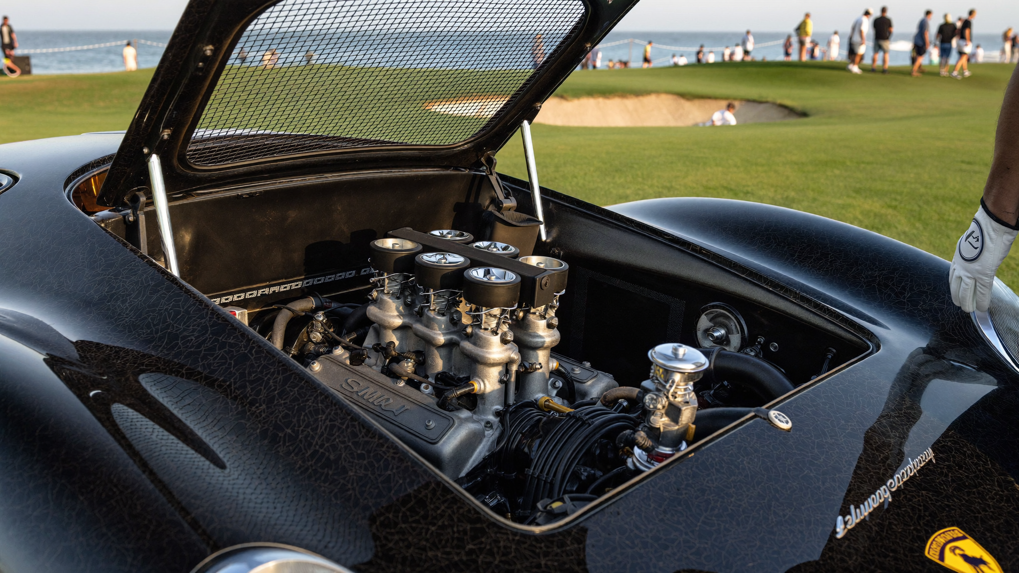 Lamborghini Miura transverse V12 engine with Weber carburetors under the open rear clamshell
