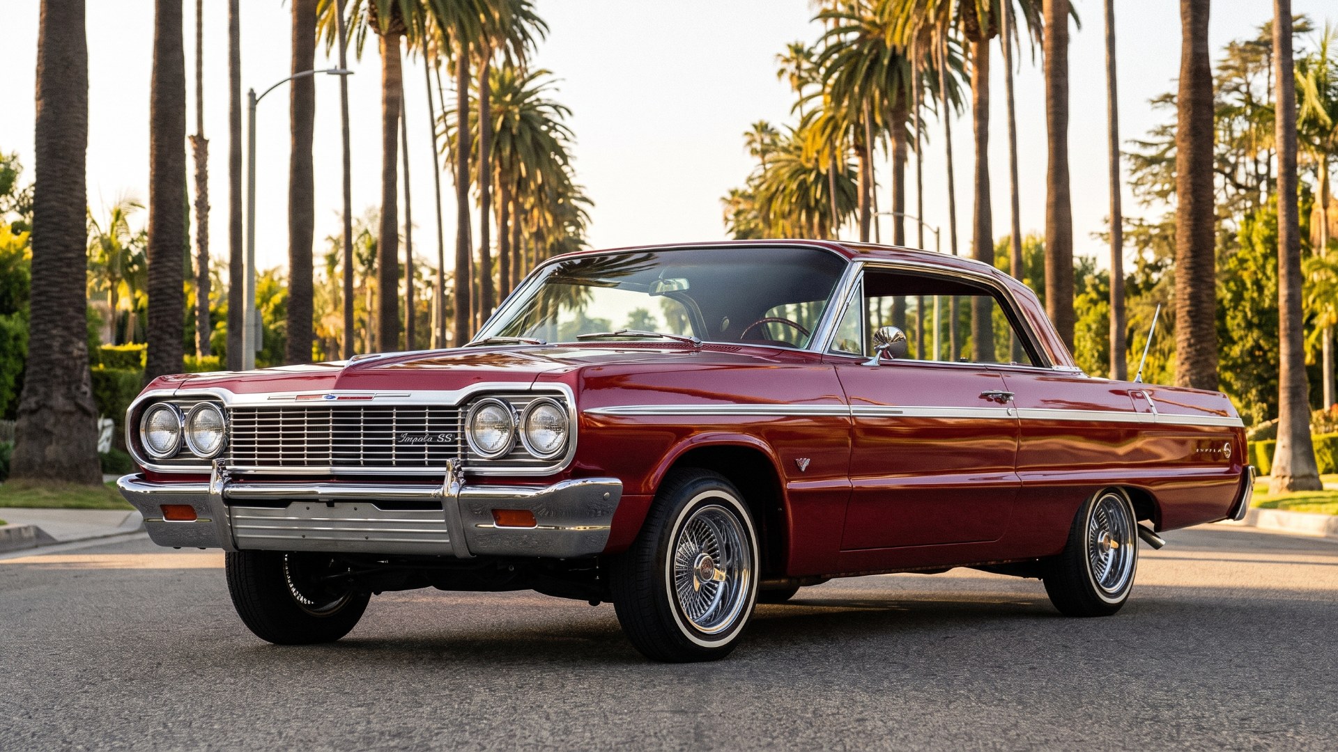Candy-red 1964 Chevrolet Impala SS lowrider on wire wheels on a Los Angeles street