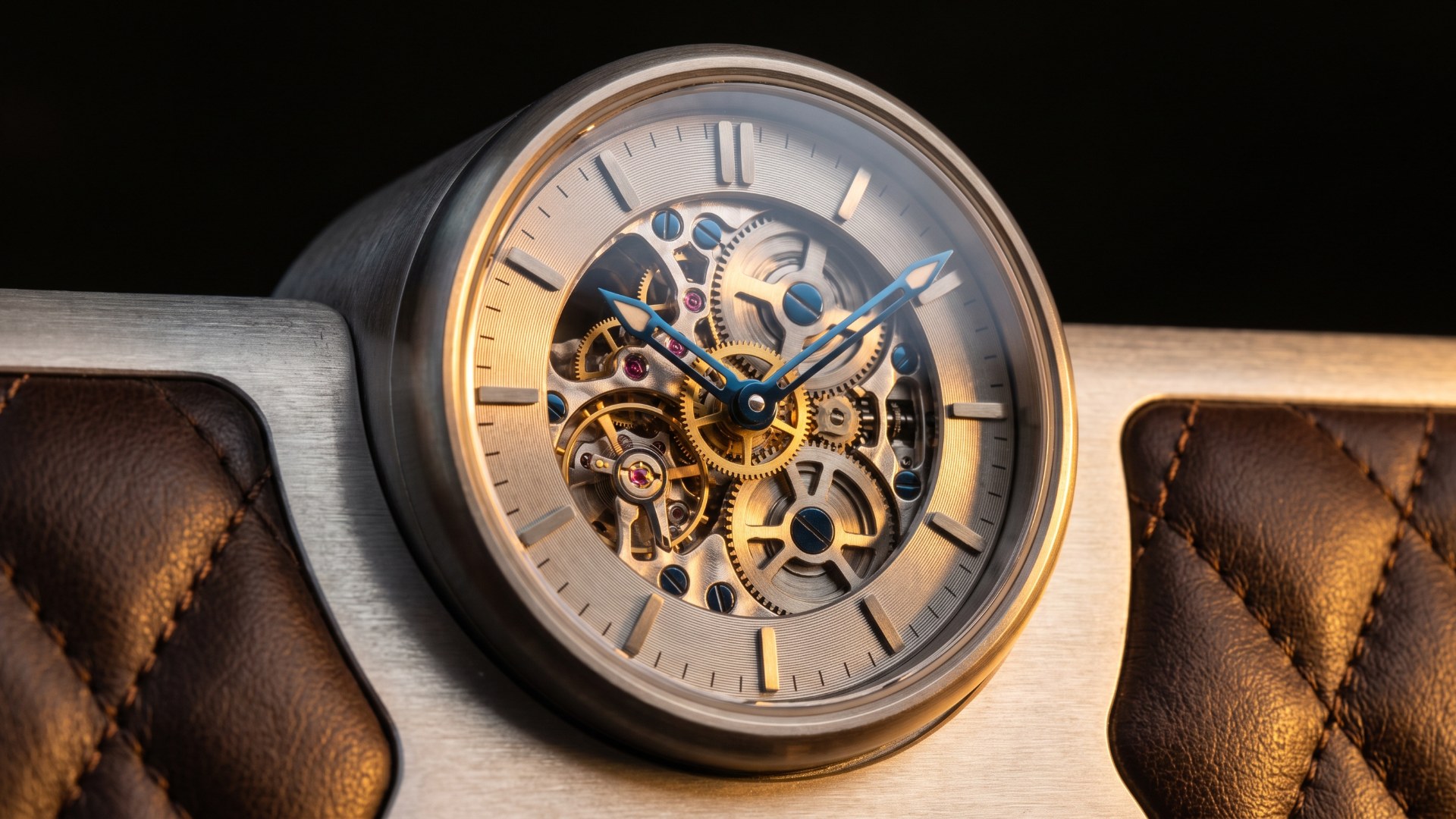 Close-up of an exposed skeleton watch movement set into brushed aluminum and quilted brown leather, illustrating Bugatti's watchmaking-inspired design language. AI-generated editorial visualization.