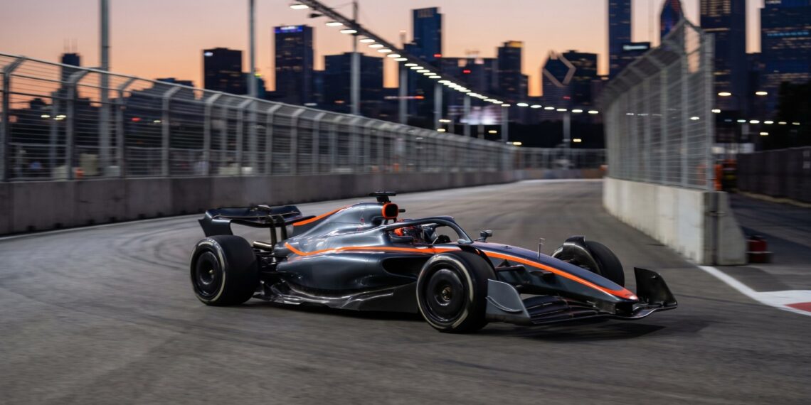Formula 1-style race car on a city street circuit at dusk as the F1 V8 engine plan for 2030 takes shape