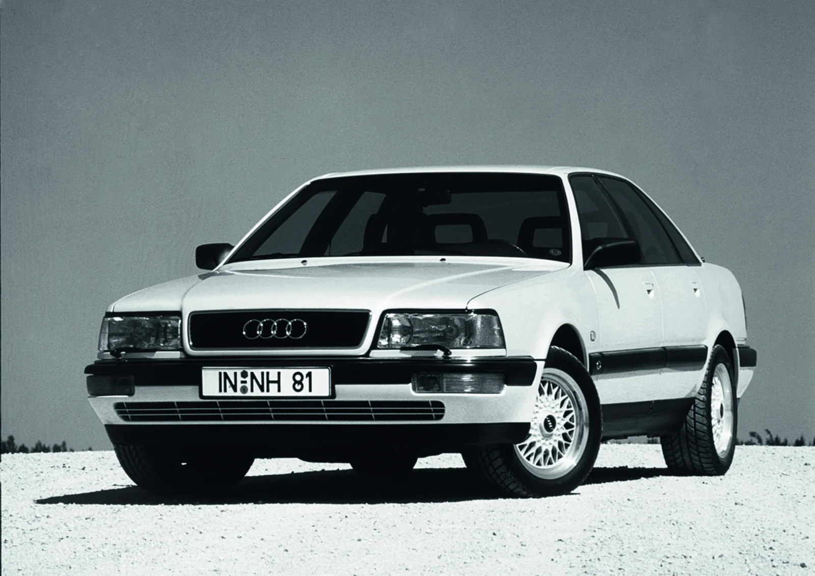 White Audi V8 sedan from 1988 in a studio