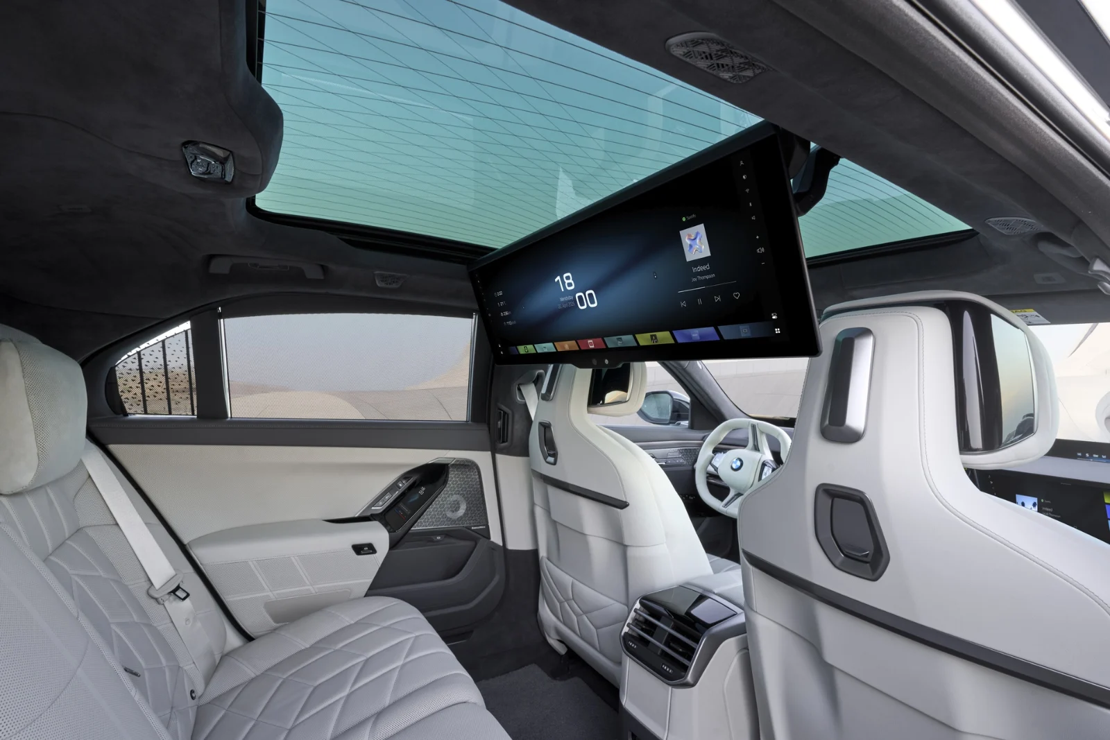 Rear cabin of the 2026 BMW 7 Series with the roof-mounted Theater Screen lowered