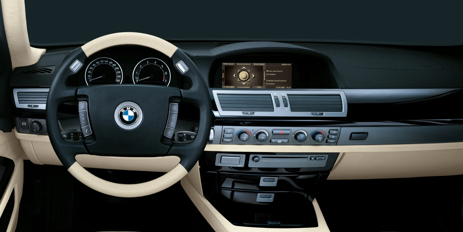 Cream and black dashboard of a BMW E65 7 Series with central display