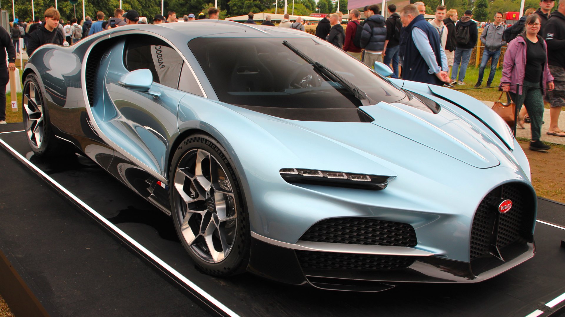 Light blue Bugatti Tourbillon hypercar on display at the 2024 Goodwood Festival of Speed, seen from the front three-quarter angle