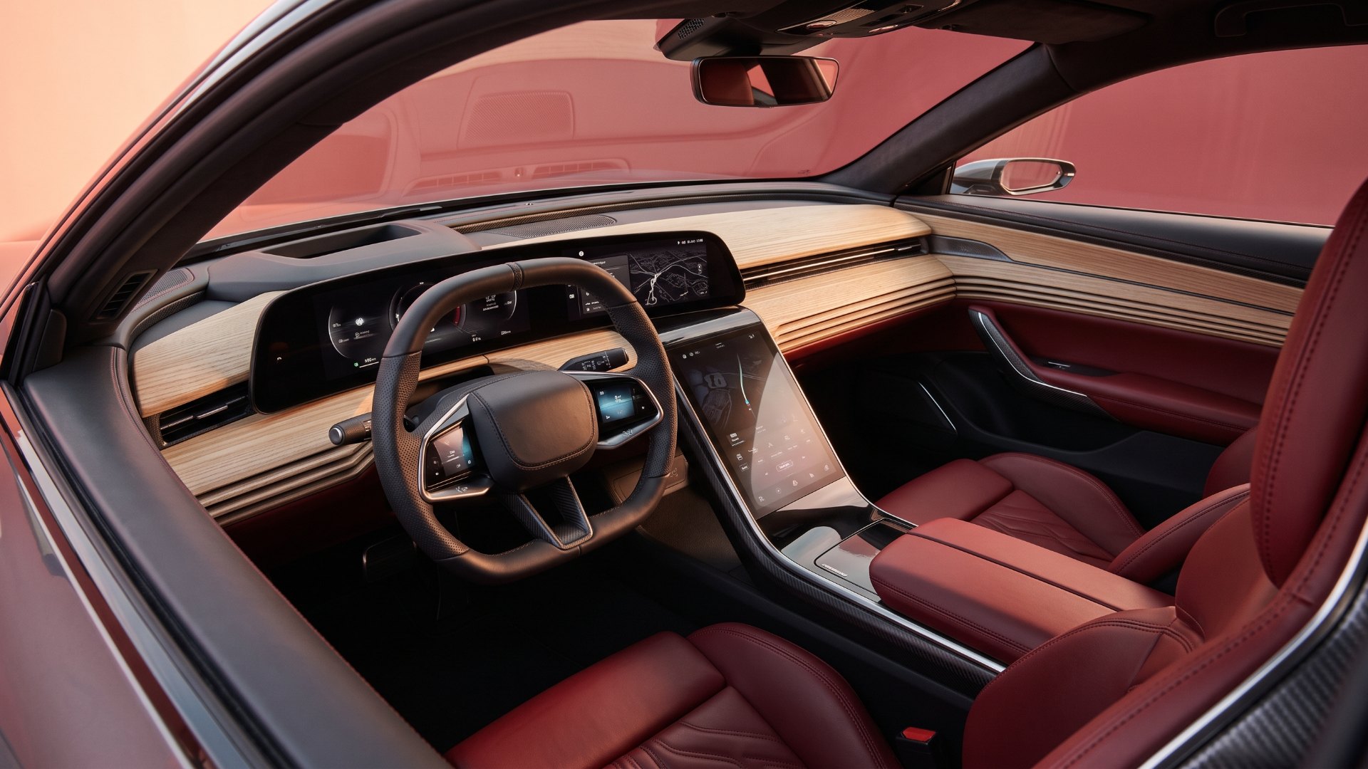 Illustration of a concept GT cabin with a curved L-shaped display, layered ash-wood dashboard and red leather seats