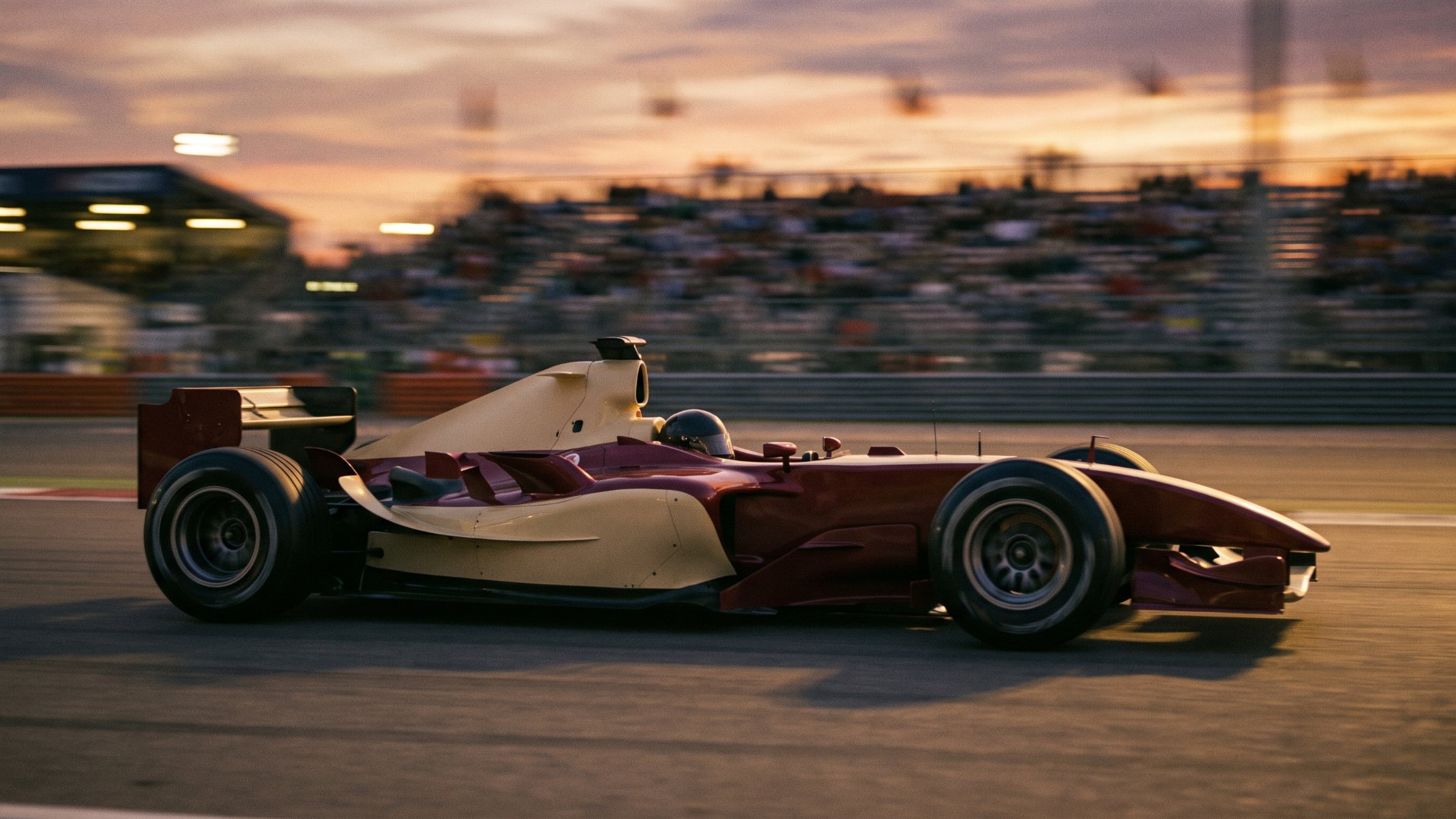 Burgundy and cream mid-2000s-style formula car passing a grandstand at dusk