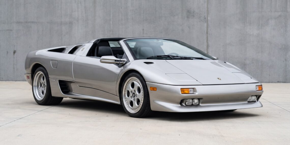 Silver Lamborghini Diablo VT Roadster with its roof panel removed, seen from the front three-quarter