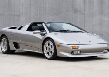 Silver Lamborghini Diablo VT Roadster with its roof panel removed, seen from the front three-quarter