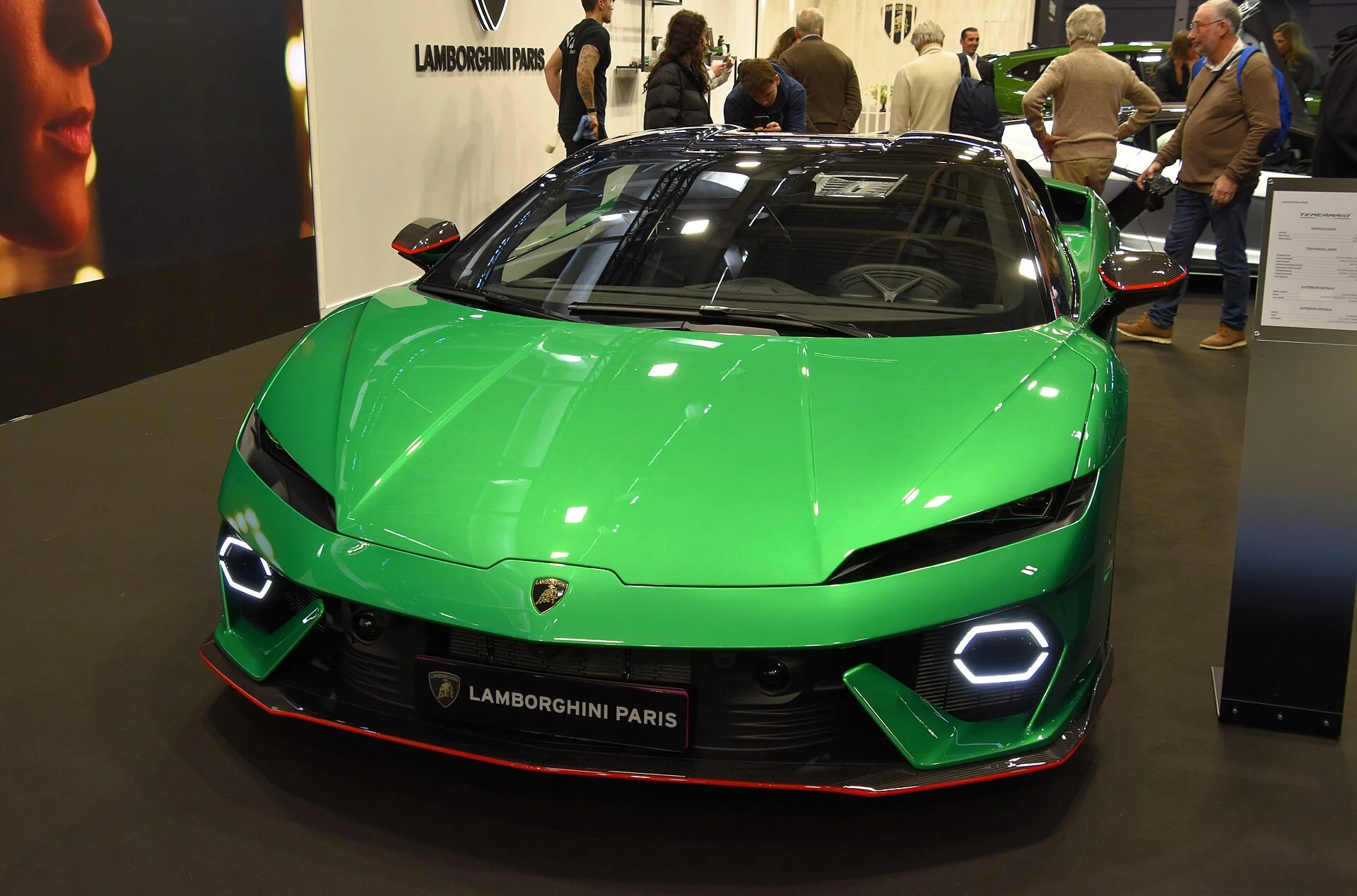 Green Lamborghini Temerario front view showing hexagonal daytime running lights at an auto show