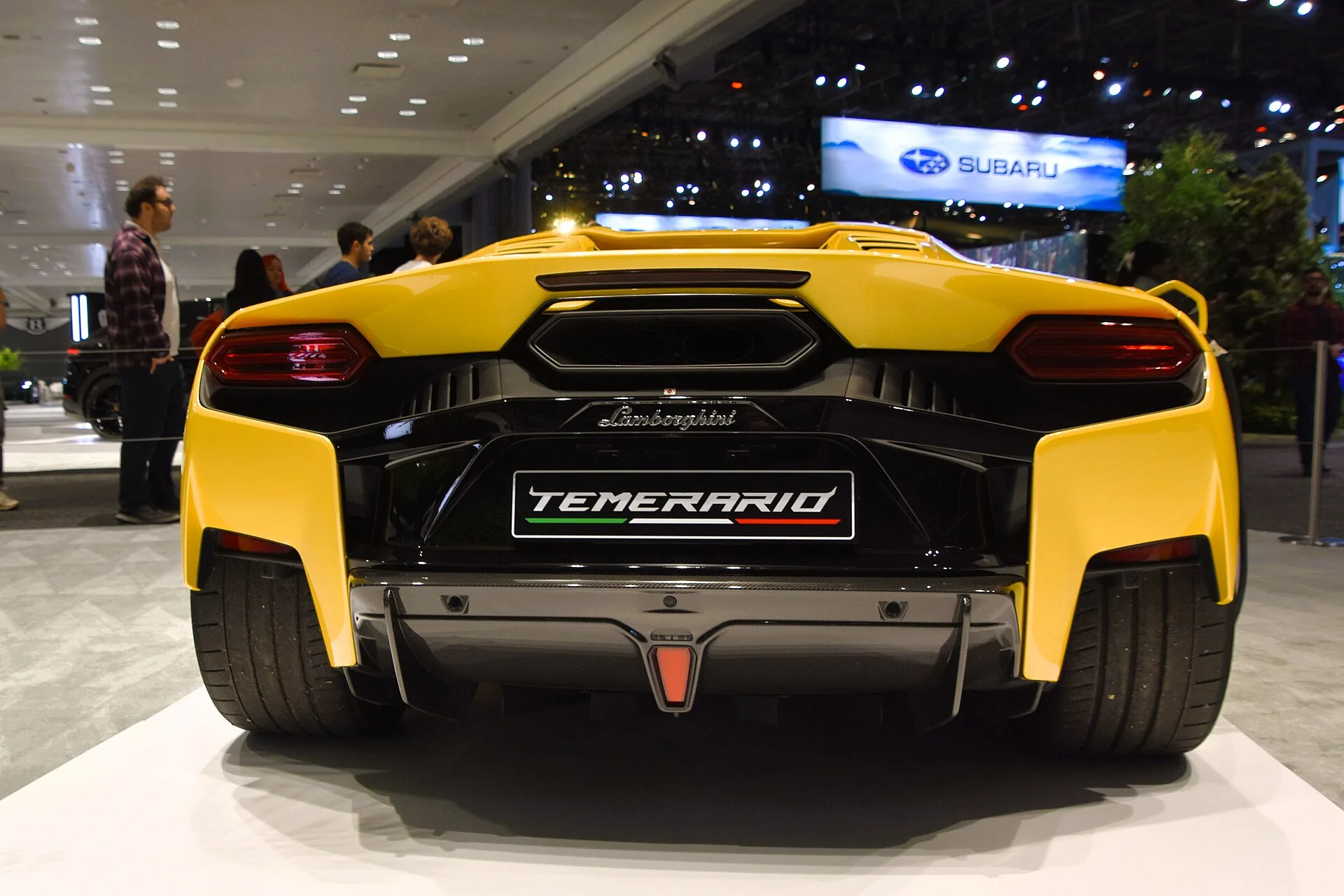 Rear view of a yellow Lamborghini Temerario showing the engine cover, taillights and central exhaust