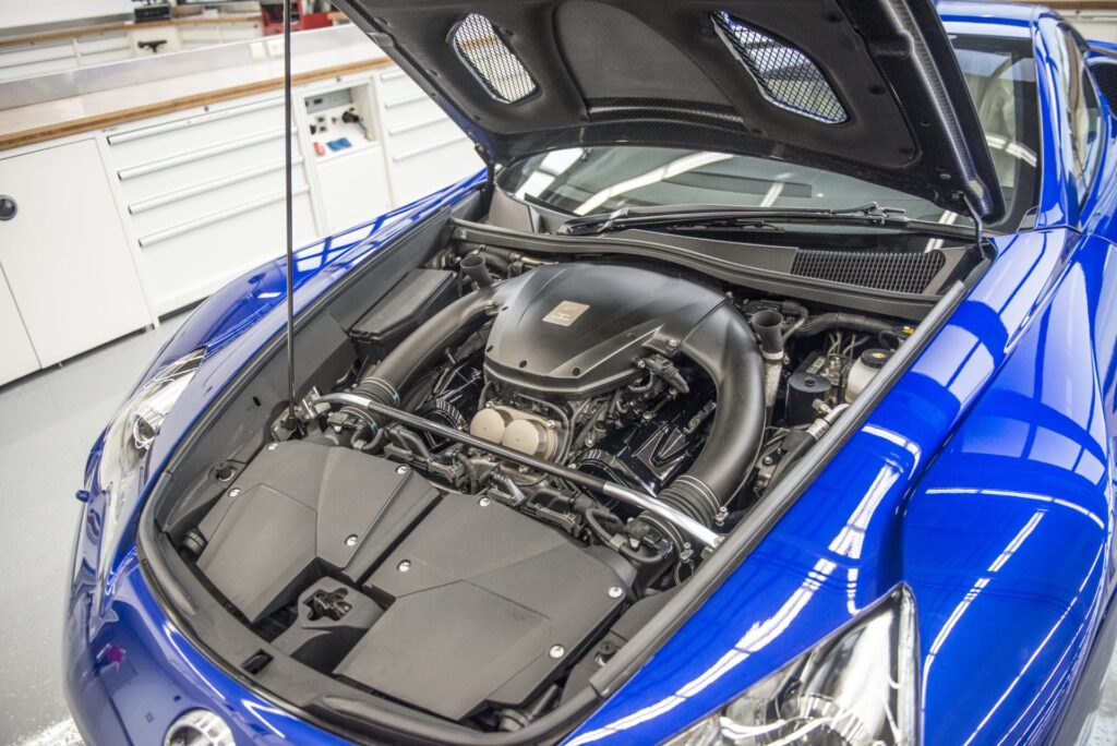 Original Lexus LFA with hood open showing its 4.8-liter V10 engine